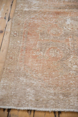 Distressed vintage Oushak runner's woven texture and subtle tone-on-tone terra cotta design.