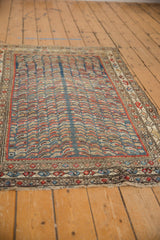 Vintage Caucasian rug features schools of fish on aqua blue field and intricate boteh border.