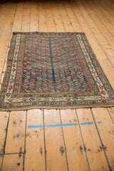 Beige main border and secured bottom edge of Vintage Caucasian rug, featuring alternating botehs.