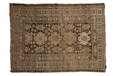 Vintage Caucasian rug with charcoal and ivory starburst design, unique pawn border, 3'4
