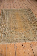 Antique Kula rug's multi-layered border and ivory fringe.