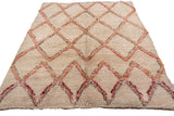 Thick plush pile of vintage Moroccan rug with ivory, tangerine, and cherry red diamond lattice.