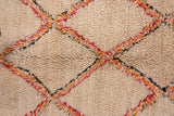 Thick plush ivory pile with tangerine and faded cherry diamond lattice pattern.