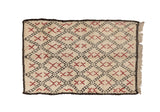 Plush vintage Moroccan carpet featuring ivory diamonds, charcoal lattice, and cherry red X motifs.