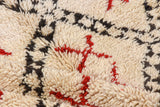 Vintage Moroccan carpet with plush ivory pile, charcoal and cherry red geometric diamond panels.