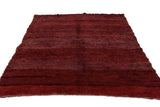 Vintage Moroccan carpet's textured pile in deep striated wine red and burgundy abrash.
