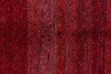 Textured pile detail of vintage Moroccan carpet, rich wine, burgundy, and cherry abrash.