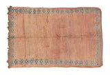 Hand-knotted vintage Moroccan carpet, pale apricot field, blue geometric serrated border. 6'10