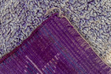 Hand-knotted purple foundation and shaggy abrash pile on vintage Moroccan carpet.