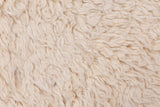 Vintage Tulu rug's plush, thick pile showing ivory, white, and antique ivory tones.
