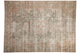 Distressed Sparta carpet, faded roundel medallion, floral vinery, muted ivory, ocean green, blush.