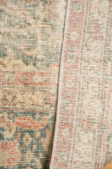 Distressed pile, faded ivory, ocean green, blush floral patterns, and side selvage.