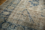 Vintage distressed Sparta rug with visible foundation weave and muted navy geometric details.