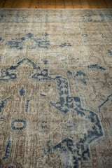 Distressed vintage Sparta rug detail, showing worn pile, visible foundation, and dusty navy motifs.