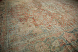 Distressed vintage Mahal carpet with faded dusty brick, light blue, and ivory curvilinear motifs.