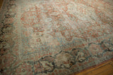 Distressed Mahal carpet with even wear, showing muted terra cotta, charcoal, and ivory floral patterns.