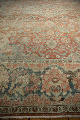 Distressed Persian Mahal rug detail: faded floral vines, worn texture, and soft fringe.