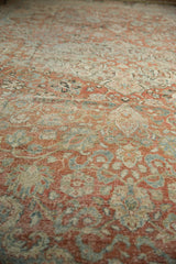 Distressed Mahal carpet pile showing worn knot heads, terra cotta, ivory, and pale blue patterns.