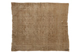 Distressed vintage Turkmen square rug, faded beige and brown, subtle gul motif.