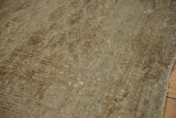 Worn pile of a Distressed Turkmen rug showing faint foundation and scattered holes.