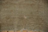 Distressed vintage Turkmen rug pile with mostly even wear, faint foundation, tattered end.