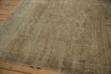 Tattered edge and worn beige gul pattern of the vintage distressed Turkmen rug.