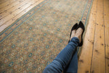 Allover herati motif and arabesque floral border on this distressed vintage Bijar runner, softened tones.