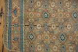Distressed Bijar runner pile, worn beige herati motif, blue, terracotta, with faint foundation and border.