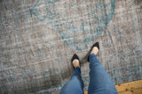 The worn-to-the-foundation texture of a vintage Oushak in silver and dusty turquoise.