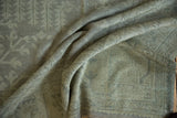Distressed vintage Oushak carpet pile showing even wear and time-softened silver-beige tones.