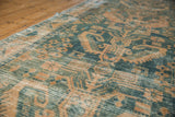 Distressed Hamadan runner, dusty ocean green geometric patterns and faded beige surface wear.