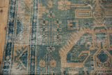 Distressed vintage Hamadan runner, dusty ocean green and beige geometric pattern with visible foundation.