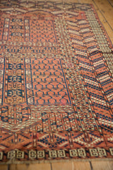 Close view of the short pile and complex geometric borders on an antique Turkmen rug.