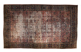 Distressed vintage Persian Bibikabad rug, dusty red allover floral and navy palmette border.