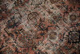 Worn foundation texture of a vintage Bibikabad rug field, with raspberry and navy Harshang-Herati motifs.