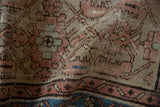 Distressed vintage Hamadan runner pile, showing faded terracotta, silver, and indigo blue.