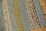 Hand woven Turkish Kilim texture with powder blue, dusty gold, and beige striped abrashes.