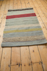 Polychromatic striped flat weave texture and secured edge of the Turkish Kilim.