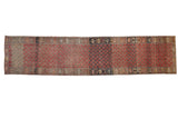 Vintage distressed Oushak rug runner with repeating floral cross-sections in madder red, silver, and beige.