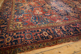 Vintage Karaja rug's reciprocating samovar border and geometric field with jewel tones.