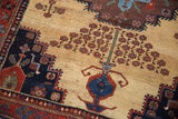 Antique Afshar rug detail: unusual ivory ground, geometric tree of life floral motifs, and stepped navy border.