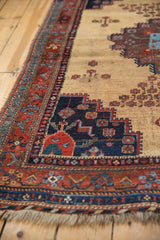 Antique Afshar rug's geometric stepped medallion in deep aubergine with rich red border and fringe.