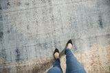 Distressed vintage Sparta carpet texture with faded blue and ivory, showing wear to foundation.