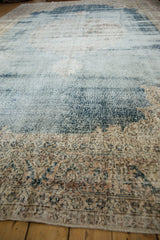 Textured vintage Sparta carpet pile, revealing distress, faded denim blue, and ivory tones.