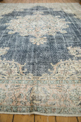 Distressed navy blue and ivory Turkish Sparta carpet pile with worn knot heads and foundation.