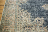 Worn navy field, dusty rose trefoil motif, and ivory border of a vintage Sparta carpet.