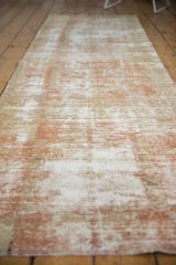 Vintage Oushak runner's distressed texture showing pale terracotta, beige, ivory, and foundation.