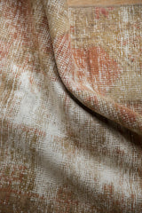 Worn knot heads and foundation visible on vintage distressed Oushak rug in pale terracotta, sand, ivory.
