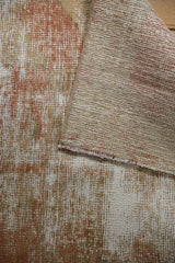 Distressed vintage Oushak rug detail with worn pile, pale terracotta hues, and visible foundation.