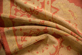 Textured pile of vintage Oushak rug, showing even wear and dust brick red serrated leaf design.